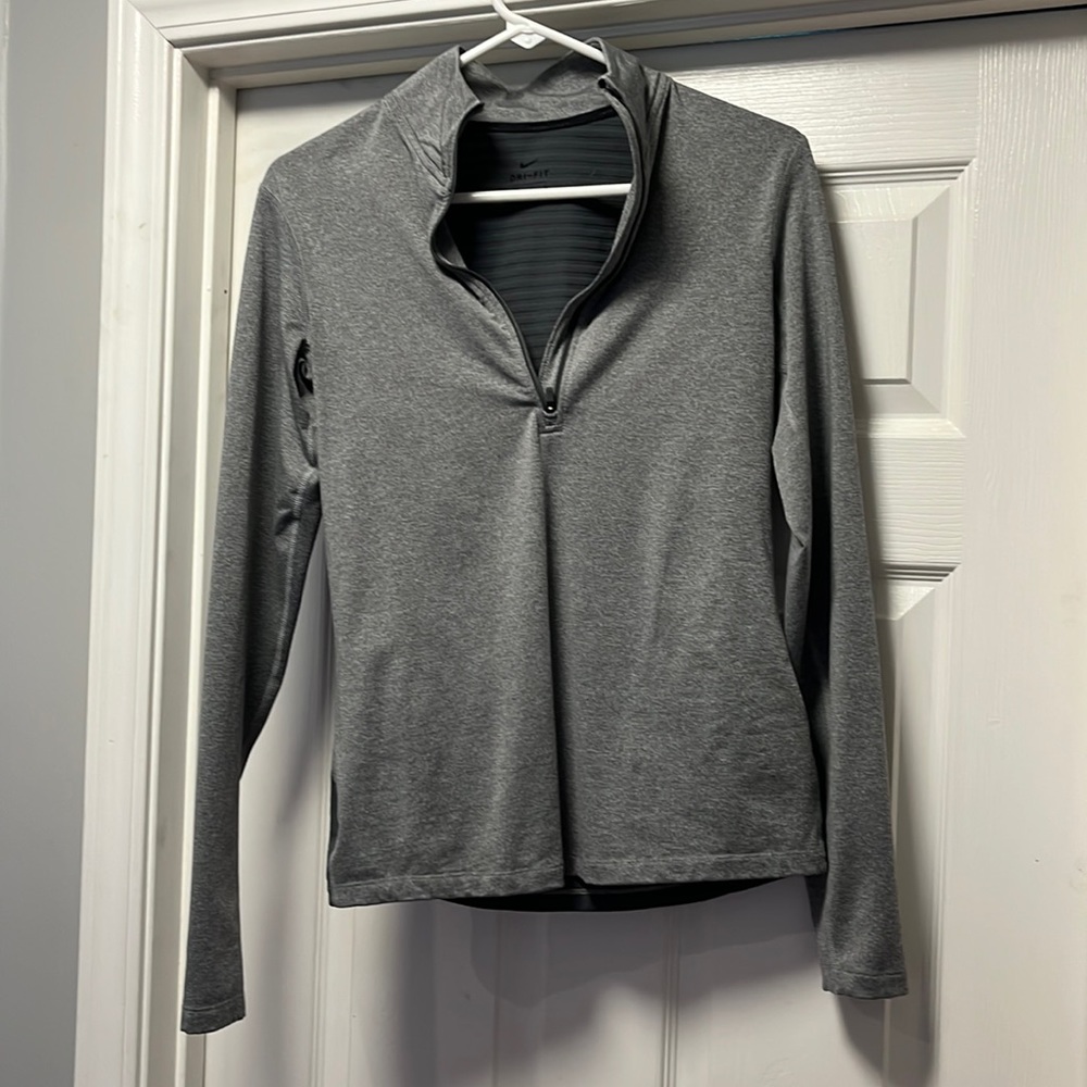 Medium, form fitting, Nike quarter zip.